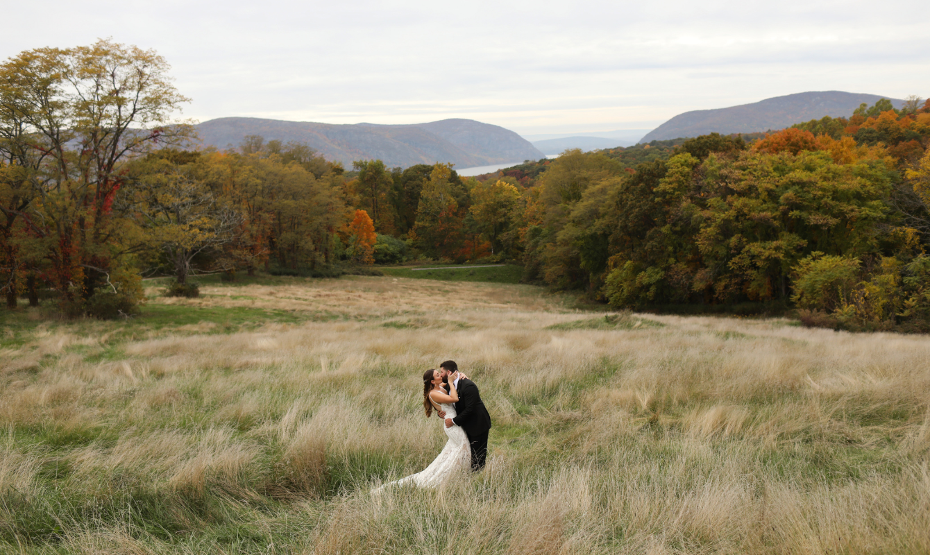 Content Wedding Couple In Field Celebrating