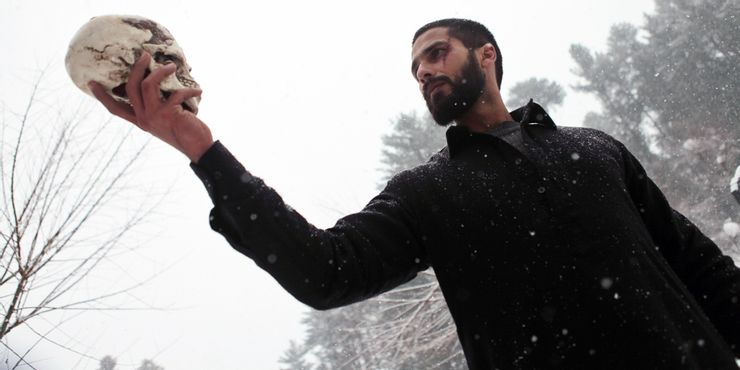Shahid Kapoor holding a skull enacting the famous Hamlet scene in a still from Haider